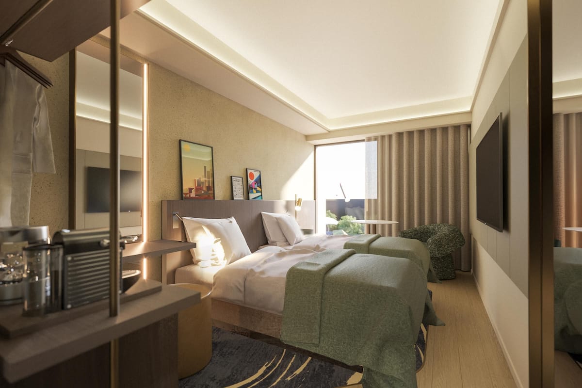 A modern hotel room with a bed, a desk, a chair, a television, and a window with curtains.