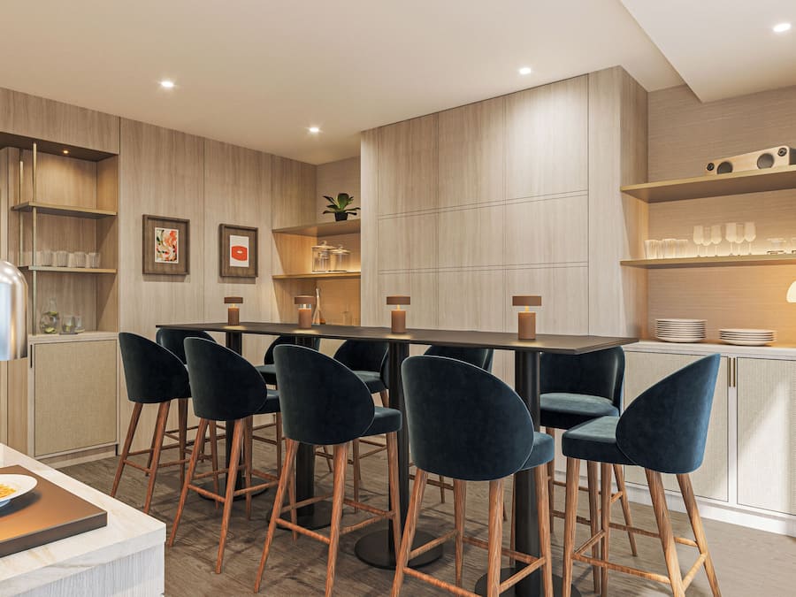 A modern kitchen with a dining area, featuring a wooden table, dark chairs, and a bar counter with stools.