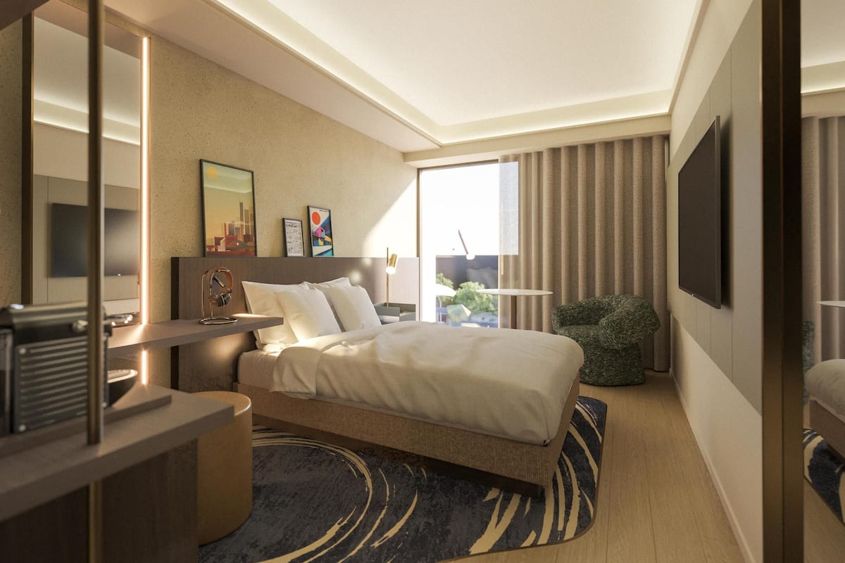 A modern hotel room with a large bed, a desk, a chair, a flat-screen TV, and a large window with curtains.