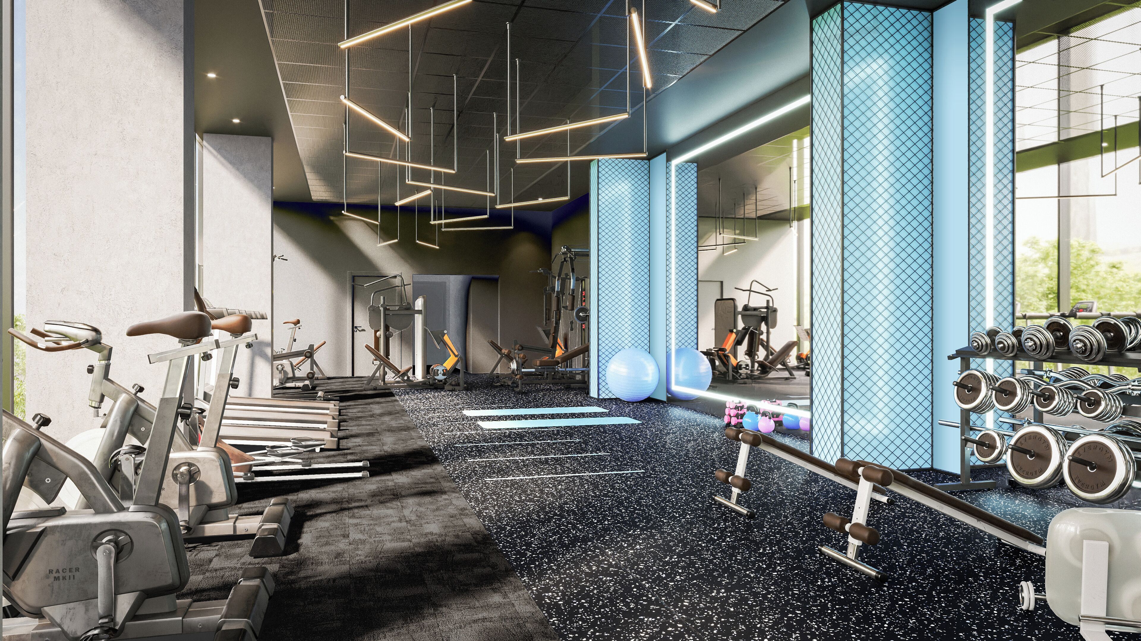 A modern gym with various exercise equipment, including treadmills, stationary bikes, and weight machines.