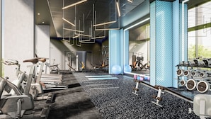 A modern gym with various exercise equipment, including treadmills, stationary bikes, and weight machines. - Radisson Blu Medlock Hotel, Manchester (Manchester)
