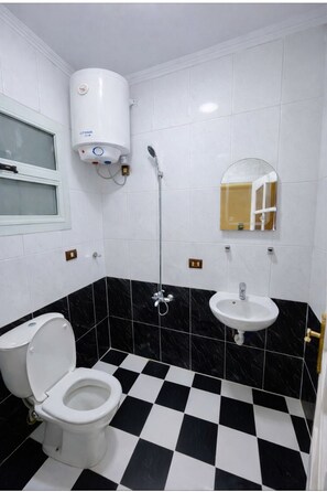 Comfort Apartment, 3 Bedrooms, Sea View, Beachfront | Bathroom | Hair dryer, slippers, towels, soap