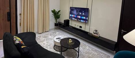 Luxury Apartment | Living area | Flat-screen TV