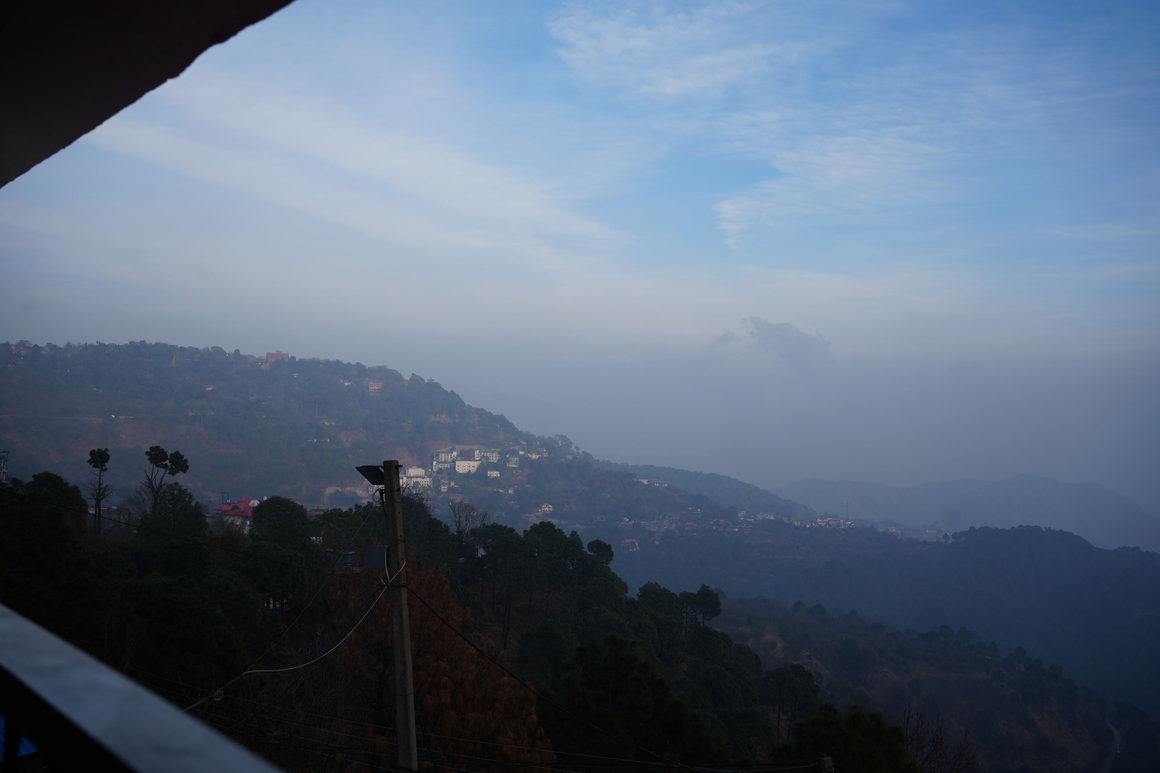 A mountainous landscape with a town nestled in the valley.