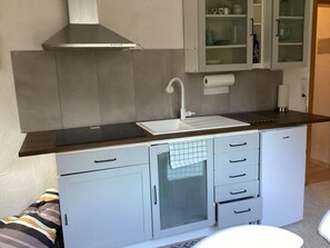 Fridge, microwave, stovetop, coffee/tea maker