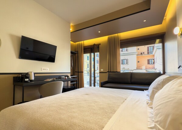 Deluxe Quadruple Room, Private Bathroom, City View | In-room safe, desk, laptop workspace, blackout drapes