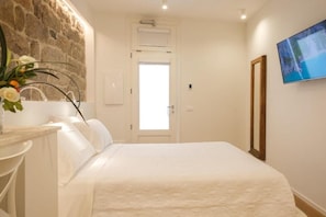 Habitación Confort | Edredones de plumas y colchones con acolchado adicional