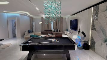 Deluxe Apartment, Balcony, City View | Games room