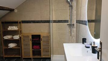 Shower, hair dryer, towels, toilet paper