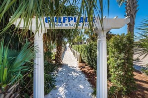 A pathway leading to a private beach area with a sign reading "GULFPLACE PRIVATE BEACH ACCESS". - ☀️Balcony | Walk to Beach | 30A | Gulf Place Caribbean 406☀️ (Santa Rosa Beach)