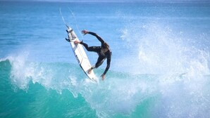 A surfer riding a wave. - Epicswellhouse (Aourir)
