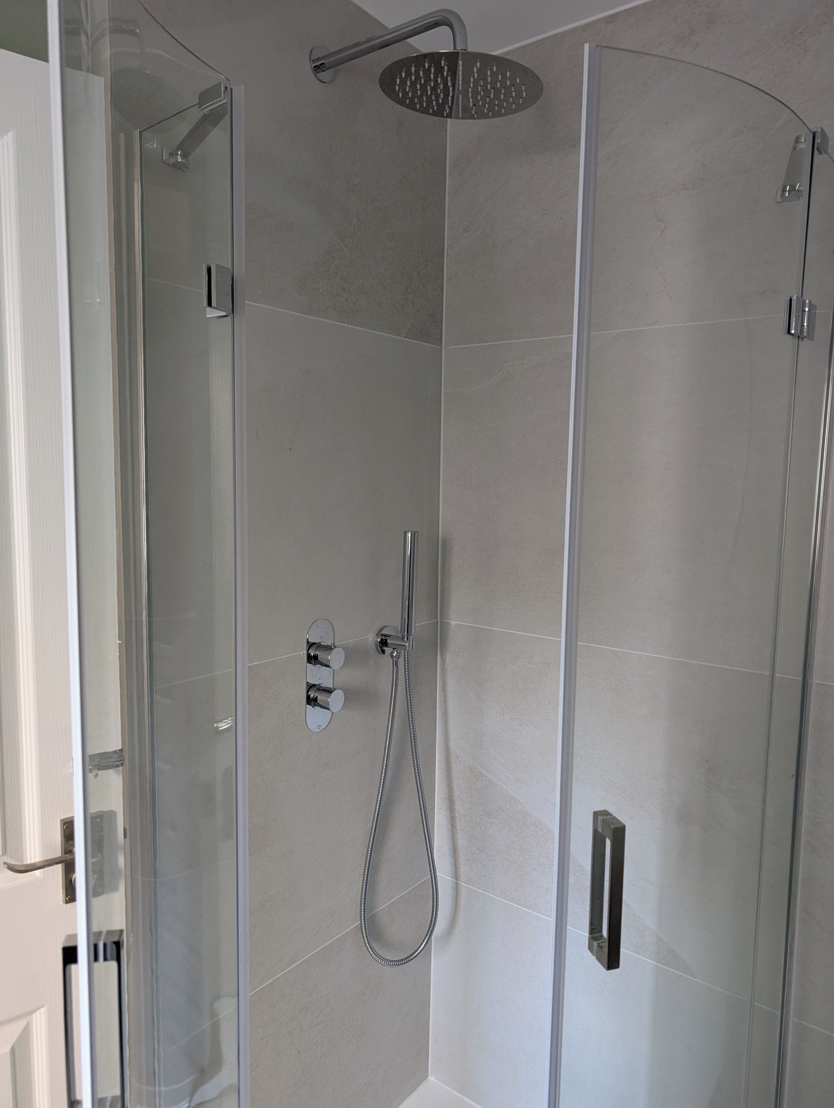 Shower, hair dryer, towels, toilet paper