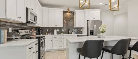 Luxury Townhome, 2 Bedrooms | Private kitchen | Coffee/tea maker