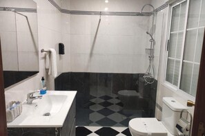 Shower, hair dryer, towels, soap