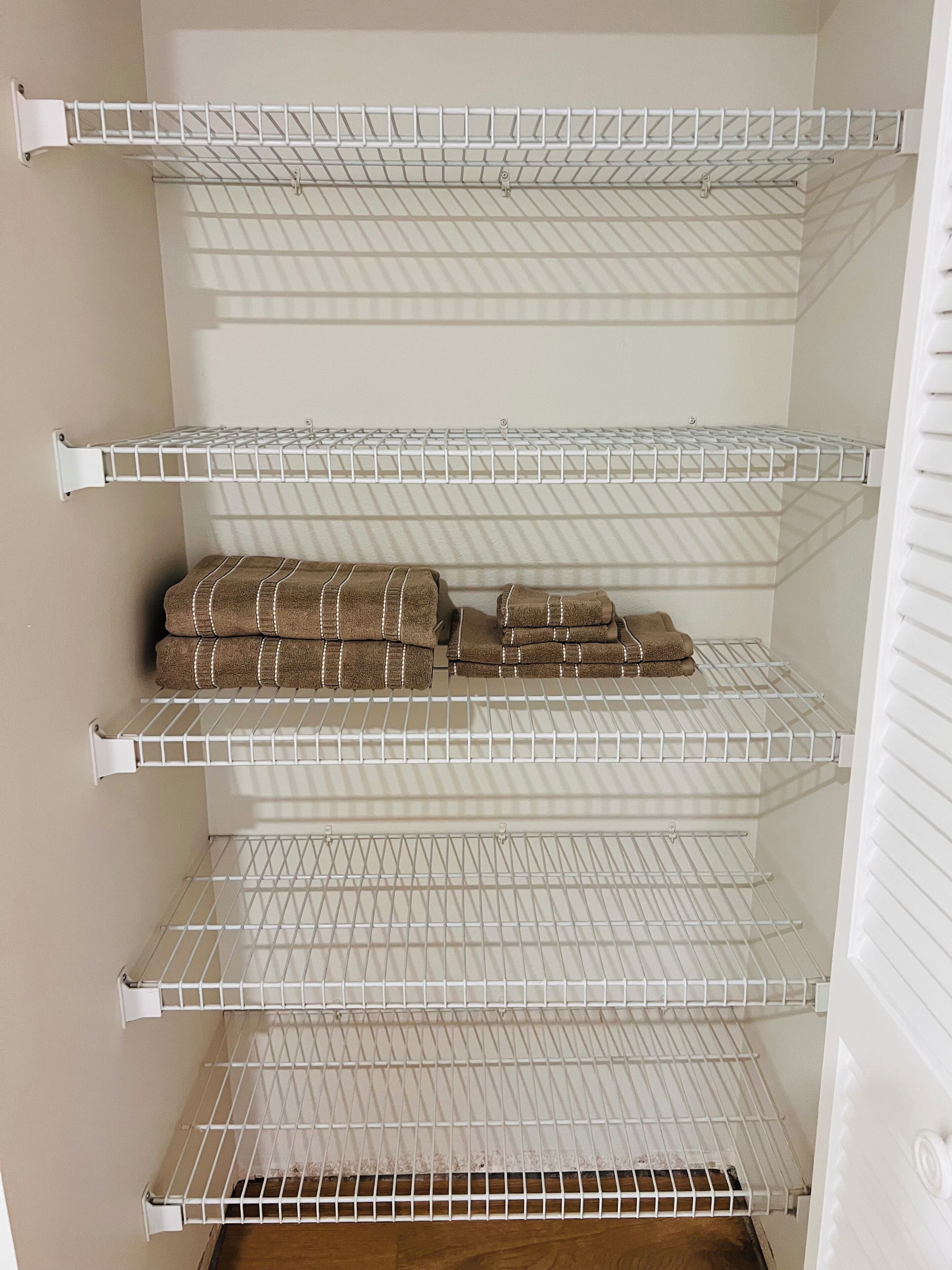 A storage unit with multiple wire shelves.