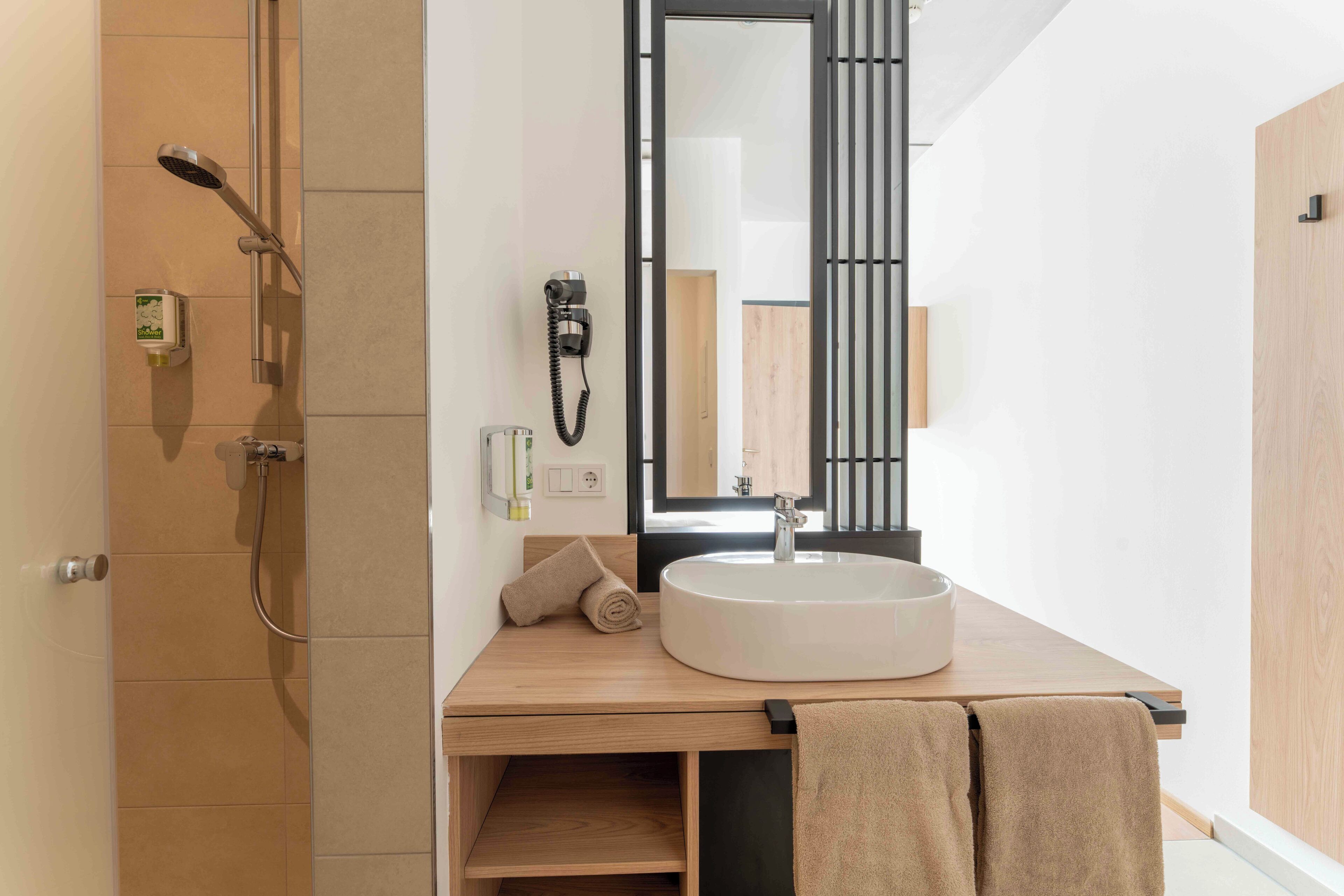 Shower, hair dryer, towels, soap