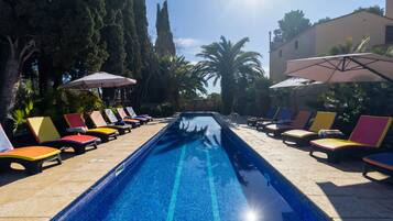 Outdoor pool, open 8:00 AM to 8:00 PM, pool umbrellas, pool loungers
