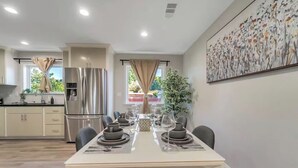 A modern kitchen with a dining area. - Spacious 6Bd/5Bath Willow Glen San Jose (San Jose)