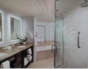 Jetted tub, hair dryer, towels, soap