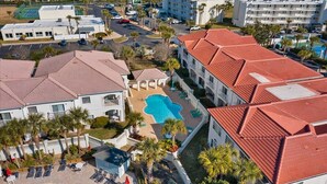 A resort with multiple buildings, a central swimming pool, and a tennis court. - Villas Of Ocean Gate II with Ocean View (St. Augustine)