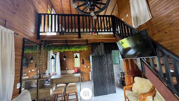 Deluxe Chalet, Jetted Tub, Mountain View | Living area | 40-inch TV with digital channels, fireplace