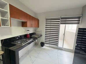 Classic Apartment, 3 Bedrooms, Patio | Private kitchen - Residencial Gran Cobae Triplex D (Tonalá)