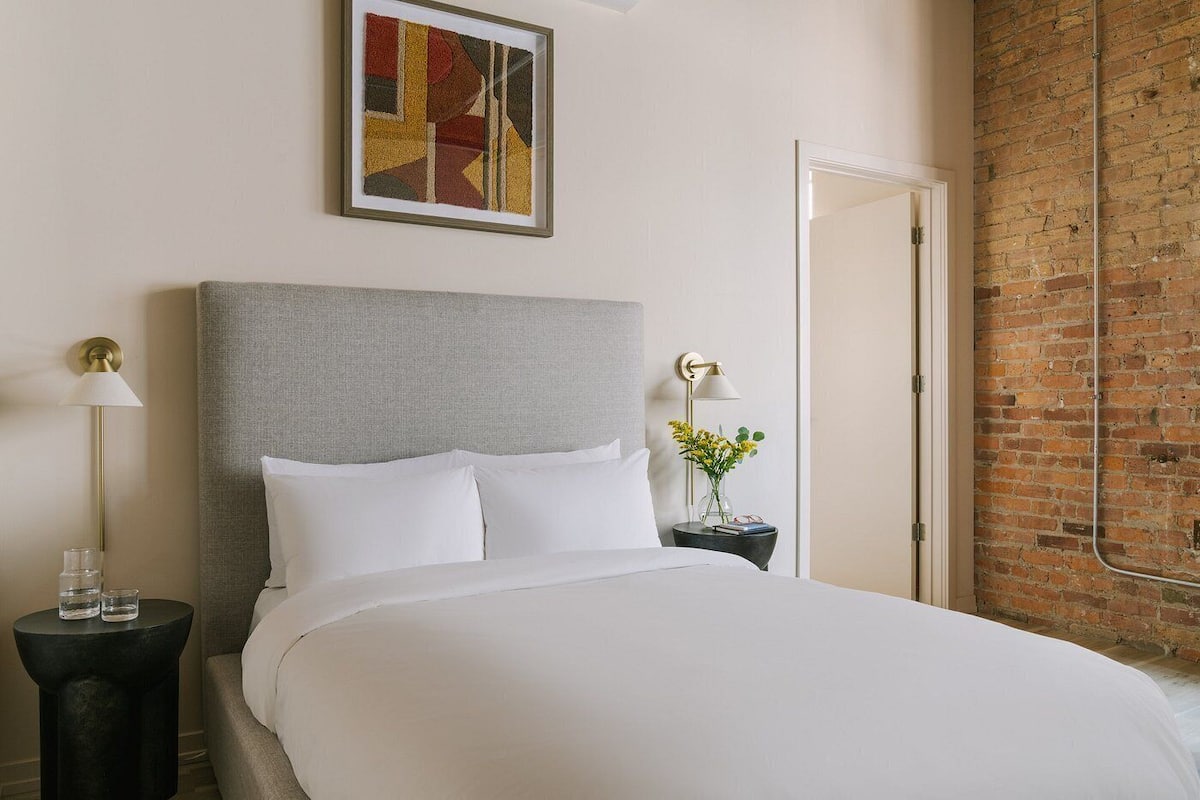 Premium bedding, laptop workspace, blackout drapes, iron/ironing board