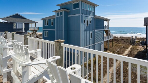 A coastal building with a balcony and a view of the beach. - Oceanfront home w/ Backyard Beach Access! (North Topsail Beach)
