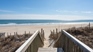 A wooden boardwalk leading to a beach with a clear sky. - Oceanfront home w/ Backyard Beach Access! (North Topsail Beach)