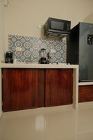 Fridge, microwave, cookware/dishes/utensils