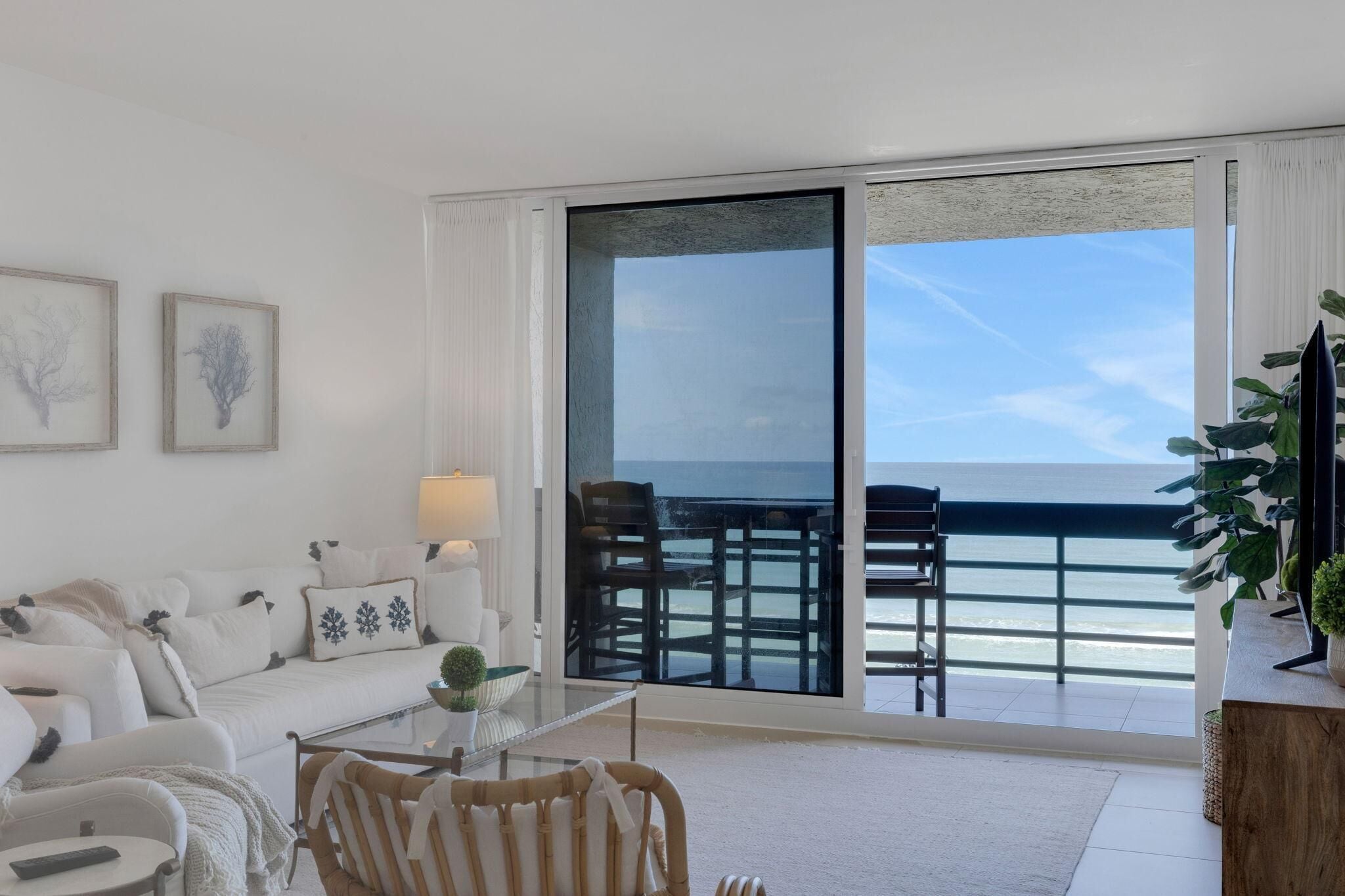 Bright living room with stunning ocean views and cozy seating