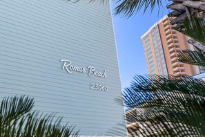 A building with a sign reading "Roman Beach 23060". - Salt and Light at Romar Beach 213 (Orange Beach)