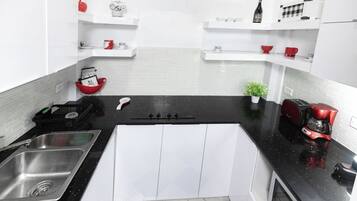 Fridge, microwave, stovetop, coffee/tea maker