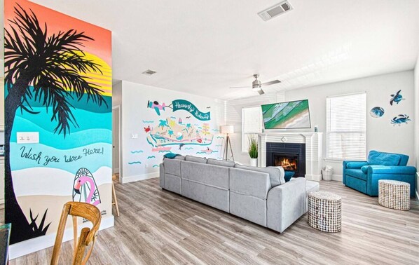 Smart TV, fireplace, foosball, books