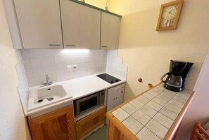 Fridge, microwave, toaster, cookware/dishes/utensils