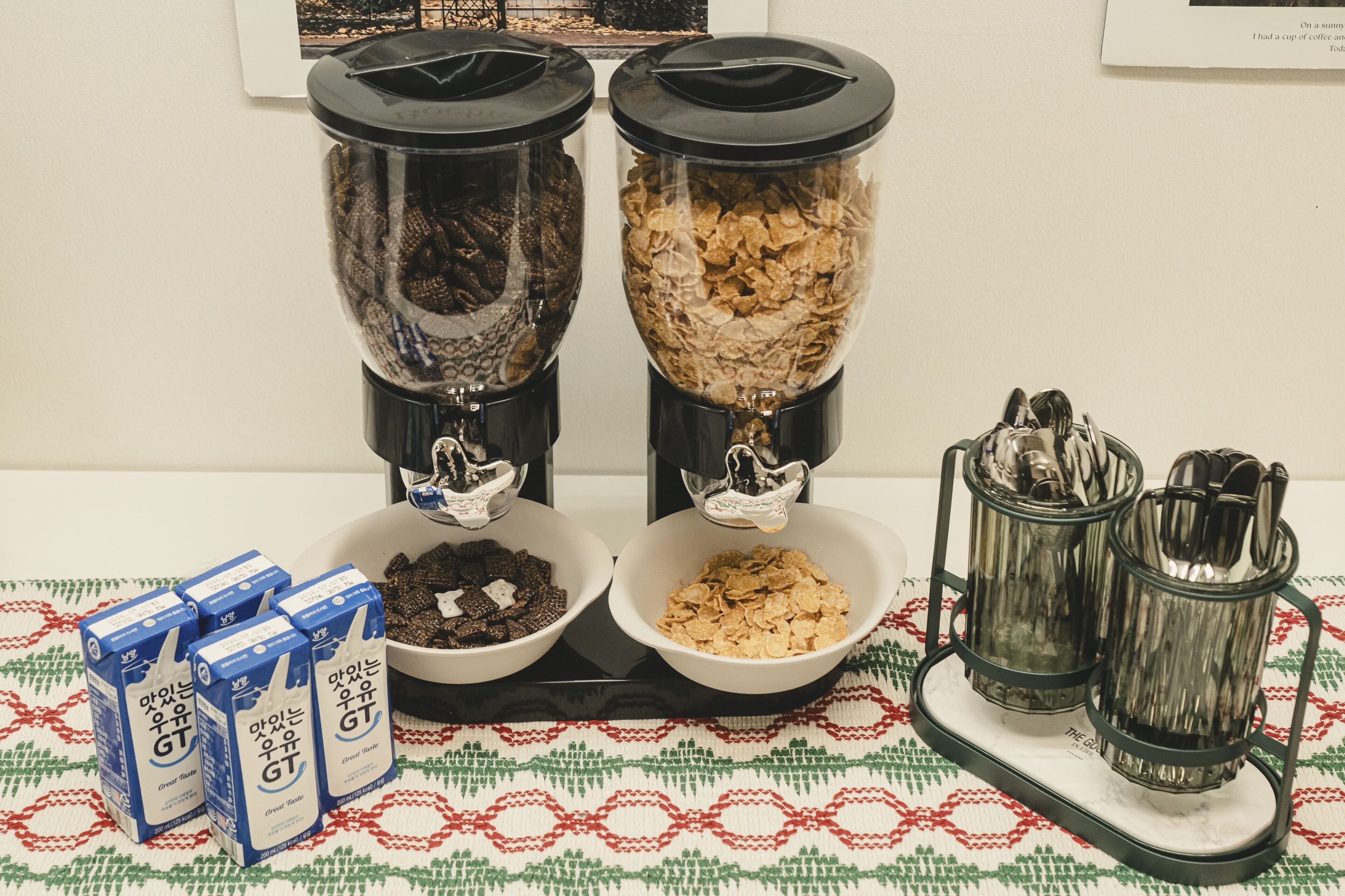 Two blenders with different contents, a tray with bowls, and a tray with utensils.