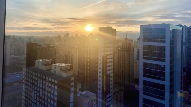 A cityscape with high-rise buildings during sunset. - 2nd tallest building in Curitiba built (Curitiba)