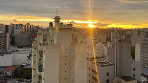 A cityscape with high-rise buildings during sunset. - 2nd tallest building in Curitiba built (Curitiba)