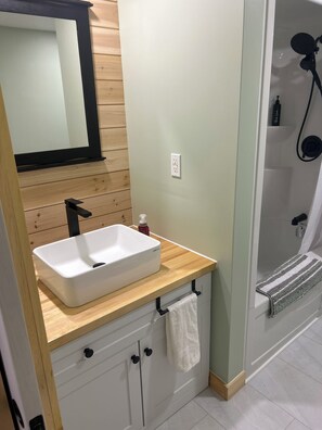 Hair dryer, towels, soap, toilet paper