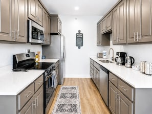 Coffee/tea maker, fridge, microwave, oven - Stylish New-Build Suite • Downtown Hot Springs (Hot Springs)