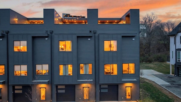A modern multi-story building with multiple windows and a flat roof. - Girls Night Out by Avantstay Private Karaoke Lounge + Hot Tub + Rooftop + Downtown Views (Nashville)