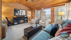 A cozy cabin interior with a fireplace, comfortable seating, and a television. - Lakefront Getaway, Swim, Laugh, Family Fun for all! Close to Kettle Moraine (Palmyra)