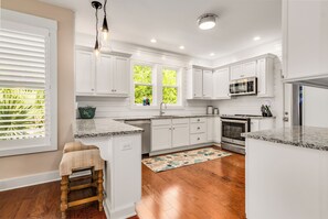 Fridge, microwave, oven, stovetop - This like-new 4BR/3.5BA home in sought-after Cape Fear Station- Pet friendly (Bald Head Island)