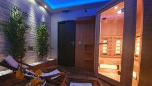 A cozy indoor seating area with wooden furniture, a table with a plate of food and drinks, and a door leading to a room with a wooden interior. - Holiday apartment with pool and air conditioning (Sv. Filip i Jakov)