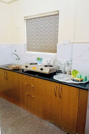 Double Room A/C | Living area | 32-inch flat-screen TV with cable channels - Visaara Luxury Homes (Anekal)