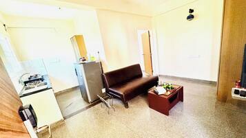Double Room A/C | Living area | 32-inch flat-screen TV with cable channels