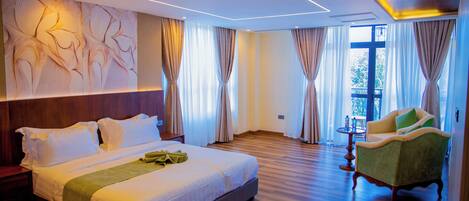 Deluxe Double Room, Balcony, Mountain View | In-room safe, desk, laptop workspace, blackout drapes