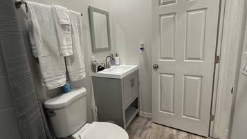 Hair dryer, towels, soap, toilet paper