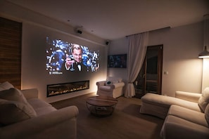 Smart TV, fireplace, books, printers