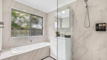 Shower, hair dryer, towels, soap